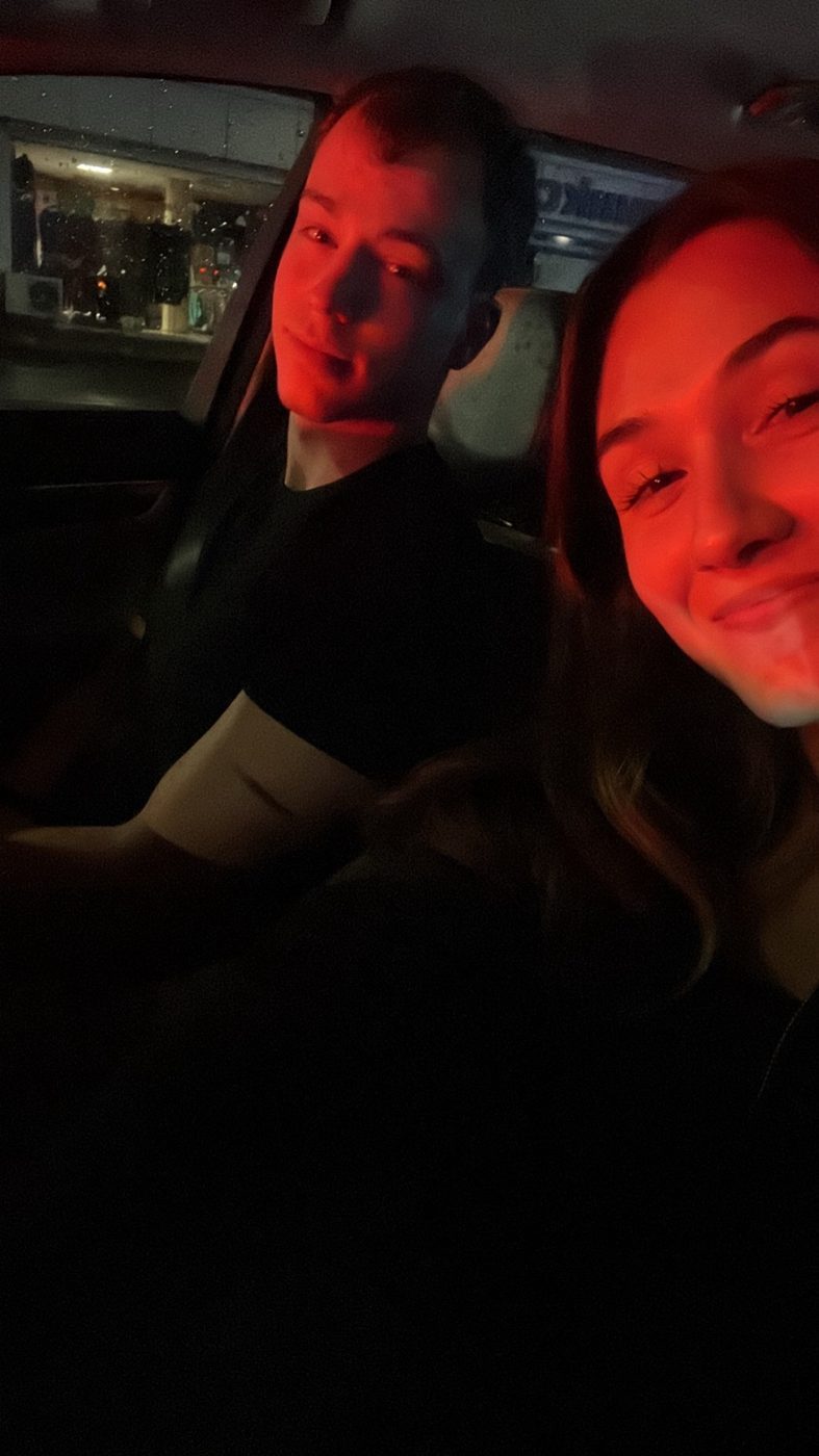 Selfie of us in the car under red light