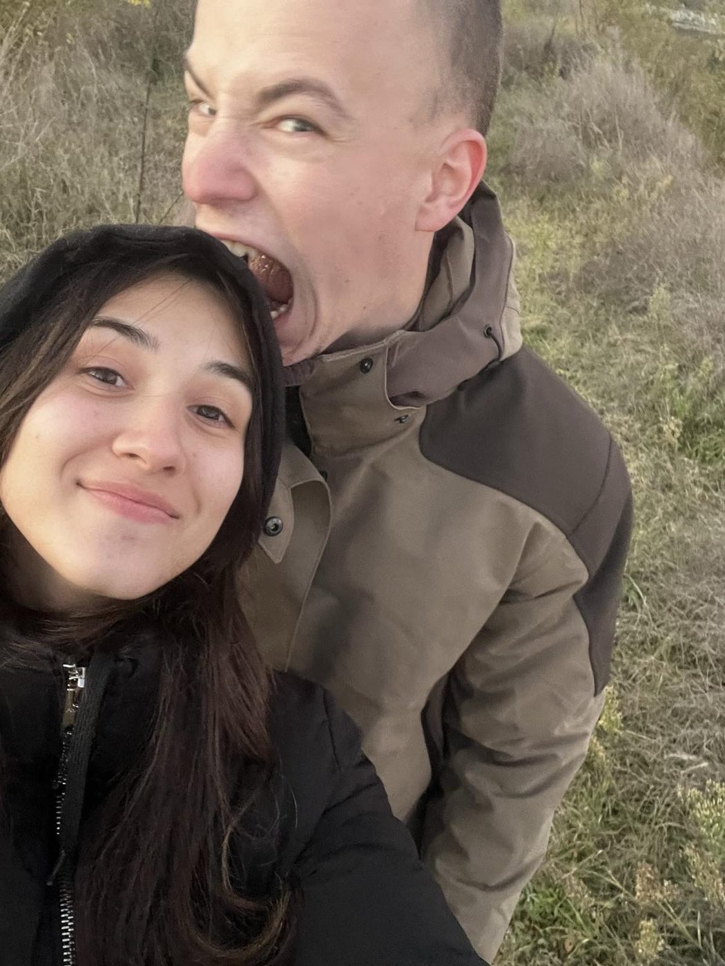 Selfie of us outdoors, Venci pretending to bite
