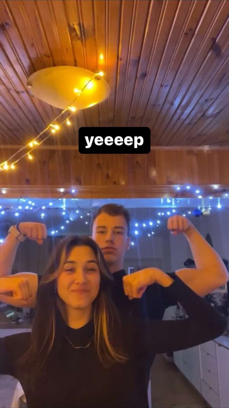 Us flexing under fairy lights